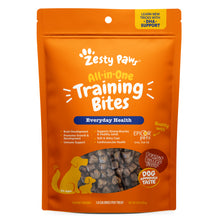 Orange Zesty Paw training bites pouch with peanut butter flavor, showing small brown treat pieces through window.
