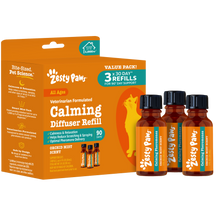 Zesty Paws calming diffuser refill pack with three amber bottles labeled "Calming & Relaxation" in orchid mist scent.